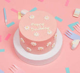 Mini Filled Sponge Cake With Daisies In Pink On A Pink Background